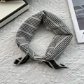 Detail of elegant black and white striped silk scarf with premium hemmed edges - 70x70cm / Wavy White