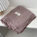 Close-up of dust pink linen scarf with subtle grid texture and brand fabric label - 180*70cm / Light Pink