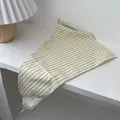 Vintage yellow checkered triangular scarf with lace tag on white wood surface - Beige Plaid