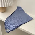 Detail of blue and white gingham cotton triangle scarf with decorative stitched label - Small Long Thin Grid