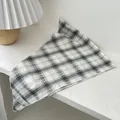 Detailed macro shot of the black and white plaid cotton scarf with waffle texture - Black Frame Grid