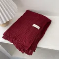 Detail of wine red pleated cotton linen scarf with an About Autumn woven label - Red