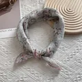 Detail view of floral silk scarf with pink lace edges and delicate flower pattern print - 58cm x 58cm / Gray