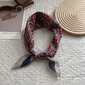 Close-up of lightweight floral silk scarf with vintage paisley print and hand-rolled edges - Totem Paisley
