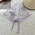 Detail of light purple mesh headscarf featuring delicate blue and pink floral embroidery - Purple