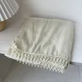 Pale green cotton linen shawl with crochet lace edges on a minimalist wooden table - Off White