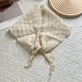 Close-up of cream plaid linen triangular scarf with detailed texture and hemmed edges - Off White