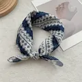Close-up of a blue and white patterned cotton necktie tied in a stylish bow knot - 58x58cm / Blue