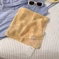 Close-up of yellow floral cotton linen scarf with be keen on label and white tag - Wheat Ear Style