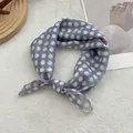 Detail of grey-blue polka dot silk scarf tied on a minimalist magazine background - 58*58cm / Beige Polka Dot