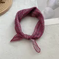 Close-up of a floral cotton linen scarf featuring vintage geometric patterns and silky texture - Red