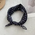 Close-up of black and white polka dot cotton linen neck scarf with soft texture - White Dot