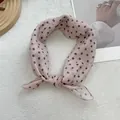 Detail of pink polka dot chiffon scarf with soft fabric texture and stitched edges - Dark Gray Dot