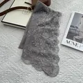 Detail of grey lace scarf with floral embroidery, pearls and sequins on white background - Lace Embroidery Pearl Style / Gray