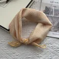 Modern bright yellow checkered cotton scarf styled in an elegant knot on a white background - Yellow