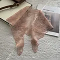 Close-up of elegant pale pink lace triangle scarf featuring delicate floral embroidery detail - 88x26cm / Pink