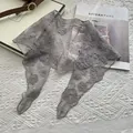 Detail of grey floral lace shawl with delicate 3D embroidery on a mesh fabric - 88x26cm / Gray