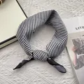 Chic black and white striped cotton neck scarf with knot detail on quilted background - Black