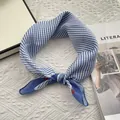 Detail of blue and white striped cotton scarf with red polka dots on white knit background - Royal Blue