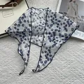 Flat lay of breathable linen scarf with blue leaf patterns and fine edge detail - 28x115cm / Blue