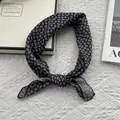 Elegant 55cm black and white paisley print square scarf tied in a stylish loop - Standard Square / Black