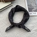 Detail of vintage floral silk scarf knotted on a white textured background - 70cmx70cm / Starry Black