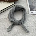 Detailed view of grey-blue floral silk scarf with rolled edges and delicate prints - 70cmx70cm / Starry Green