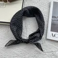 Detail of a vintage black square scarf with beige diamond pattern tied in a neat bow - 58*58cm / Khaki Square