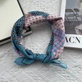 Detailed view of knotted cotton linen floral neck scarf with blue and pink geometric prints - Patchwork Floral