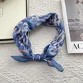Detail of blue and orange patterned silk scarf styled as a headband on knit background - 58*58cm / Blue Orange Abstract Texture (U-shaped Leopard)
