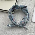 Close-up of blue floral cotton bandana with daisy print and soft texture details - Floral Blue