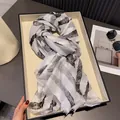 Gradient ink brushstroke shawl for sun protection featuring lightweight fringe edges - Gray