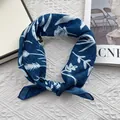 Detail of dark blue floral square scarf with white plant print and stitched edges - Navy Botanical