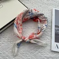 Close-up of vintage floral cotton scarf with red and blue pattern on quilted white background - 58x58 / Off White