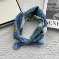 Detail of floral and bird print scarf on white knit background with a fashion magazine - 58*58cm / Blue and White Print