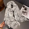 Chic cotton linen feel scarf with paisley patterns and fringe details for autumn style - Gray
