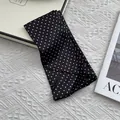 French vintage black polka dot silk scarf displayed on elegant white textured background - Fine Polka Dot Black
