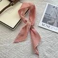 Elegant dusty pink ramie skinny scarf styled on a white vintage background - Watermelon Pink