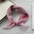 Close-up of pink paisley linen scarf showing delicate hem and lightweight texture - Pink