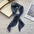 Close-up of dark blue linen scarf texture with fine edge stitching on white fabric - Navy Blue