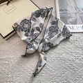 Macro detail of retro floral pattern on silk scarf with elegant navy blue flower print - Vintage Large Floral Style / Navy Blue
