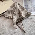 Detail of vintage floral triangular headscarf with brown rose print and stitched edges - Vintage Large Rose Style / Camel