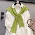 Detailed knit texture of green cable shawl paired with white button-down shirt - Yellow-Green