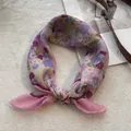 Detail of pink floral cotton linen square scarf showing soft texture and petal patterns - Purple & Pink Floral