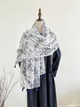 Detailed macro shot of the blue tassel edge and tree branch pattern on the white shawl - Long Style / Blue And White Branch Pattern