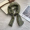 Detail of pure linen green plaid scarf with refined lock-stitch edges on a white background - Large Plaid Green