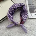 Detailed close-up of purple checkered silk scarf with butterfly print and greetings text - Purple