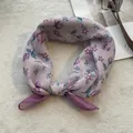 Macro detail of purple floral cotton linen scarf with elegant stitched hem finish - Purple