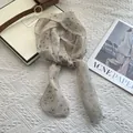 Close-up of pure linen scarf with black floral print on textured beige knit background - Small Plum Blossom