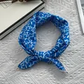Close-up of blue floral cotton scarf with white lace trim and intricate crochet details - 70*70cm / Teal